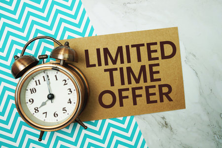 Limited Time Offer text with alarm clock on marble backgroundの写真素材