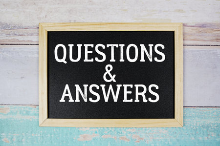 Questions &amp; Answers text with blackboard on wooden backgroundの写真素材
