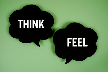 Think or Feel text with speech bubble top view on green backgroundの写真素材