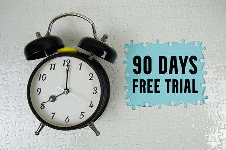 90 Days Free Trial text with alarm clock on blue backgroundの写真素材
