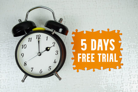 5 Days Free Trial text with alarm clock on orange backgroundの写真素材