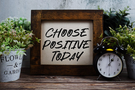 Choose Positive Today text with alarm clock on wooden backgroundの写真素材