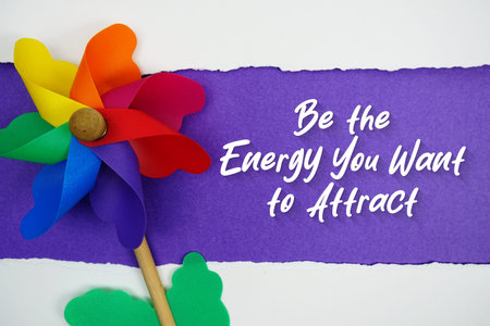 Be the Energy You Want to Attract motivational and inspirational quotes message on purple backgroundの写真素材
