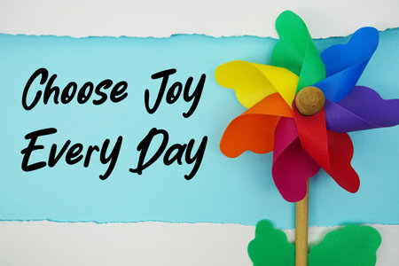 Choose Joy Every Day motivational and inspirational quotes message on light blue backgroundの写真素材