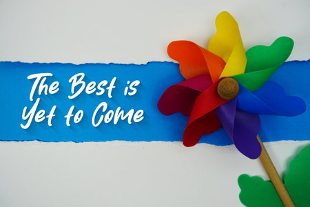 The Best is Yet to Come motivational and inspirational quotes message on blue backgroundの写真素材