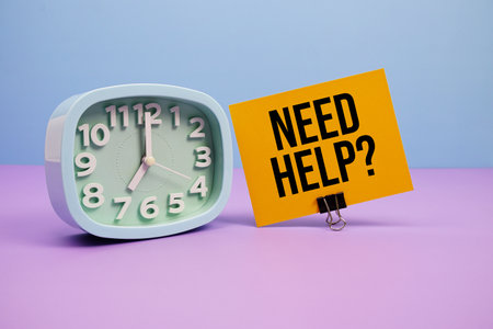 Need Help? text and alarm clock on blue and purple backgroundの写真素材