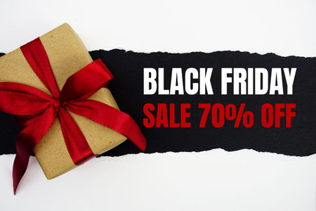 Black Friday Sale text with gift box present on black background