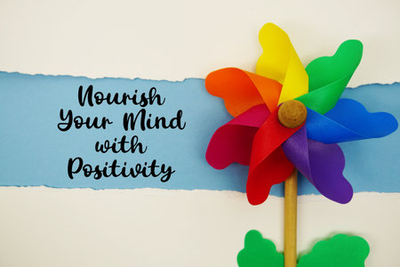 Nourish Your Mind with Positivity motivational and inspirational quotes message on blue backgroundの写真素材