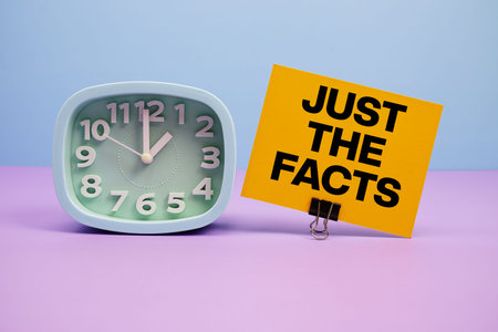 Just The Facts text and alarm clock on blue and purple background
