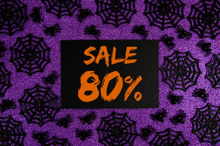 Happy Halloween Sale 80% Off with Price Tag and Halloween elements decorated on purple background