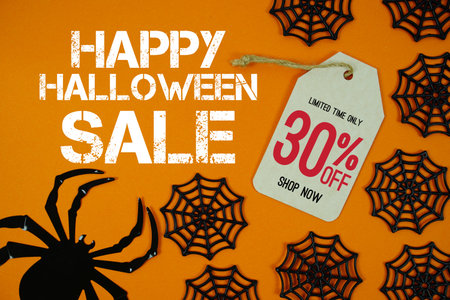 Happy Halloween Sale 30% Off with Price Tag and Halloween elements decorated on orange backgroundの写真素材