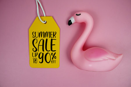 Price tag Sale 90% with pink flamingo summer decorations on pink backgroundの写真素材