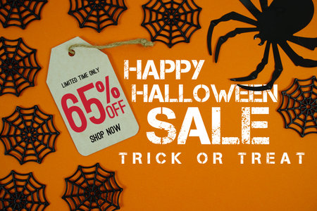 Happy Halloween Sale 65% Off with Price Tag and Halloween elements decorated on orange background