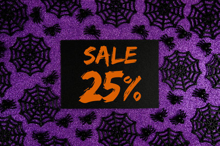 Happy Halloween Sale 25% Off with Price Tag and Halloween elements decorated on purple background