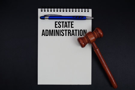 Estate Administration text written on notepad with gavel on black backgroundの写真素材