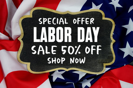 Labor Day Sale 50% off Shop Now and Special Offer written on blackboard with USA flag backgroundの写真素材