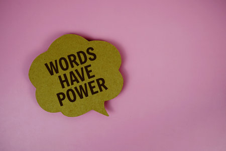 Words Have Power text with speech bubble top view on pink backgroundの写真素材