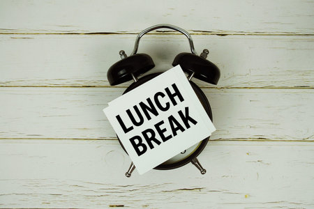 Lunch Break text with alarm clock on wooden backgroundの写真素材
