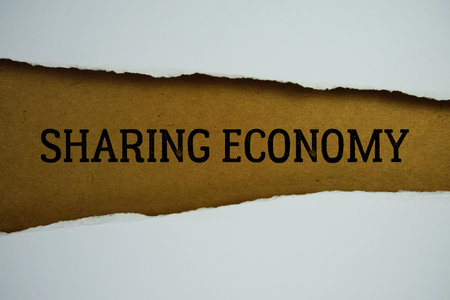 Sharing Economy text on paper craft with white paper torn ripped of horizontalの写真素材