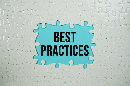 Jigsaw puzzle with a missing piece with "Best  Practices" on blue backgroundの写真素材
