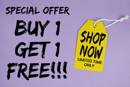 Buy 1 Get 1 Free!! special offer with price tag on purple backgroundの写真素材