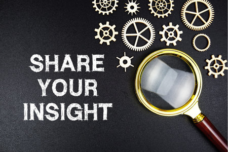 Share Your Insight text message with magnifying glass on black backgroundの写真素材