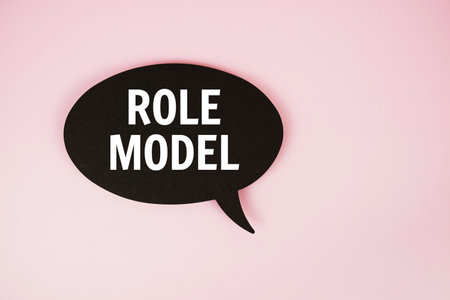 Role Model text with speech bubble top view on pink backgroundの写真素材