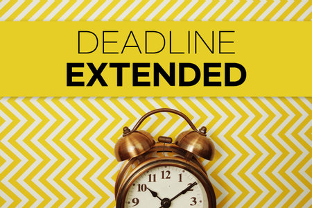 Deadline Extended text with alarm clock on yellow background