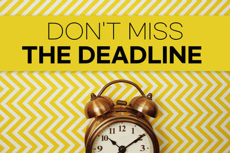 Don't Miss The Deadline text with alarm clock on yellow backgroundの写真素材