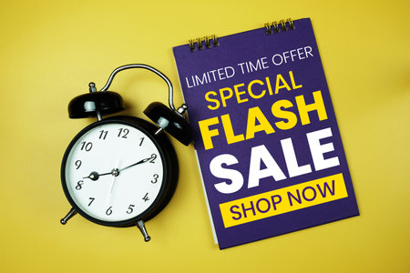Flash Sale text with alarm clock on yellow backgroundの写真素材
