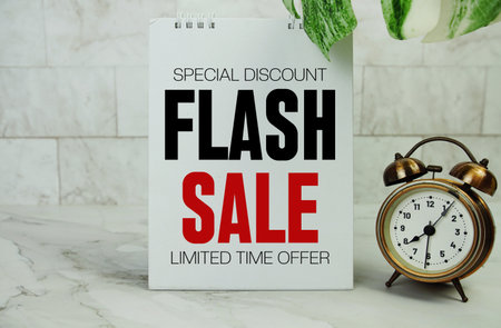 Flash Sale text with alarm clock on marble backgroundの写真素材