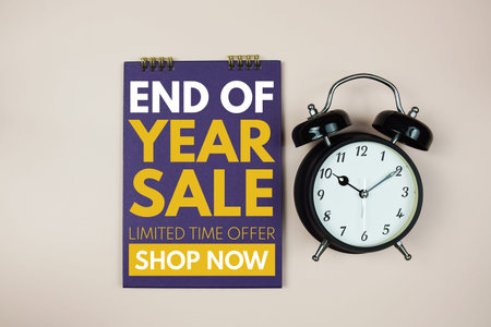End Of Year Sale text with alarm clock on pink background