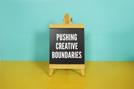 Pushing Creative Boundaries text on easel blackboard