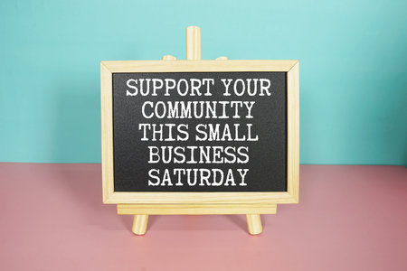 Support your community this Small Business Saturda text on easel blackboardの写真素材