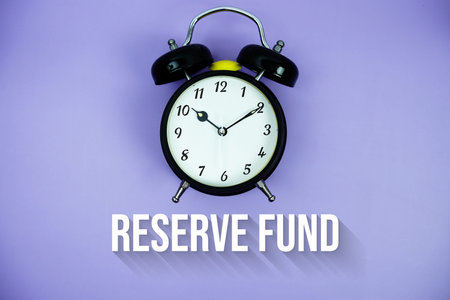 Reserve Fund text and alarm clock on purple background