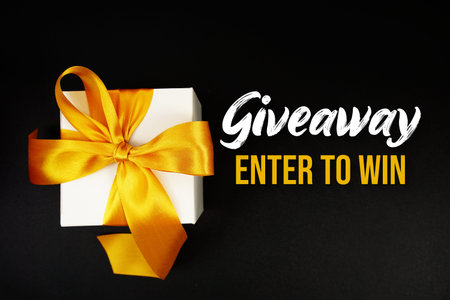 Giveaway Enter to Win text with gift box present on black background