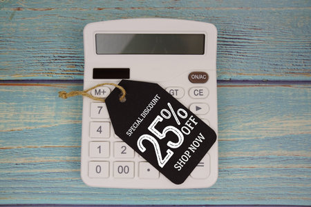 Special Discount 25% off Shop Now with price tag and calculator on wooden background