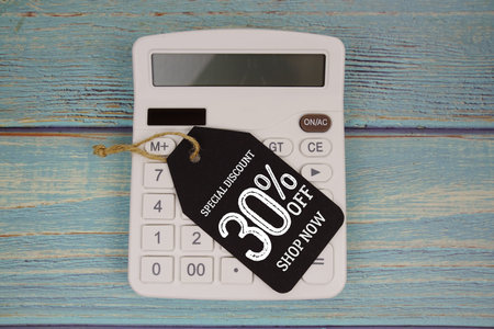 Special Discount 30% off Shop Now with price tag and calculator on wooden background