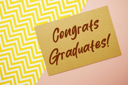 Congrats Graduates! text written on pink backgroundの写真素材