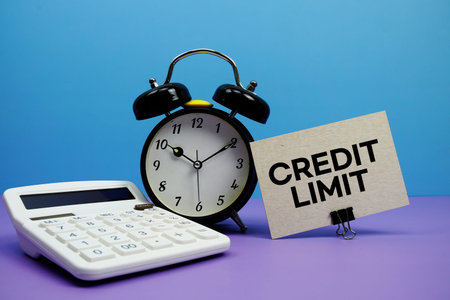 Credit Limit text with calculator and alarm clock on blue and purple background