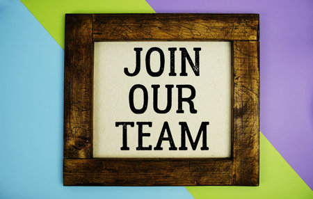 Join Our Team text written on wooden frame on