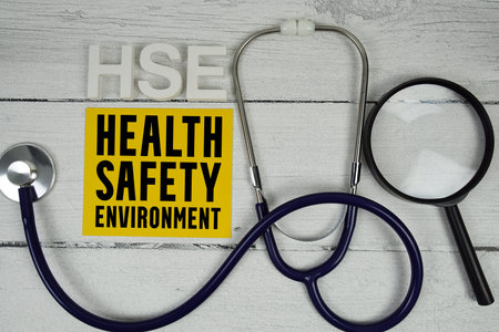 HSE Health Safety Environment text with Stethoscope on wooden backgroundの写真素材