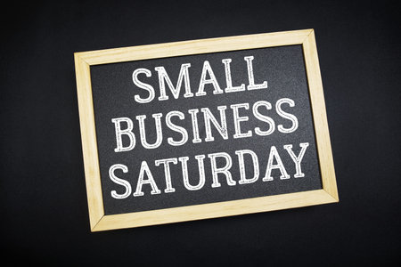 Small Business SaturdayÂ text on  blackboard on black background