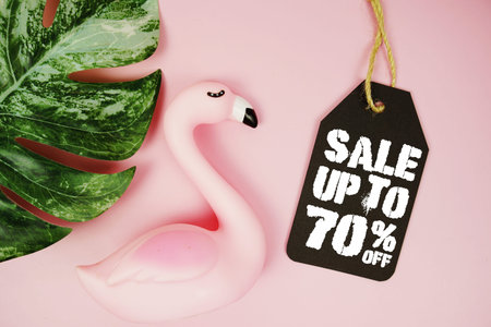Price tag Sale 70% with summer decorations on pink background