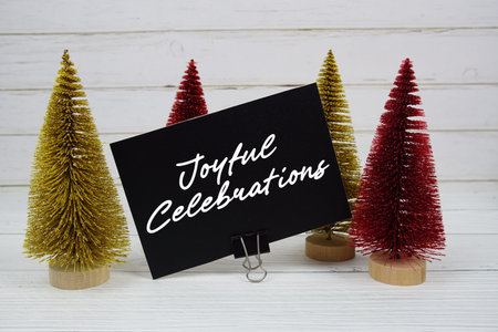 Joyful Celebrations text written on paper card for Christmas holidays celebration