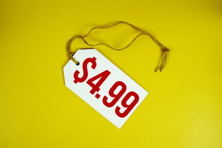 Price tag with $4.99 is placed on yellow background