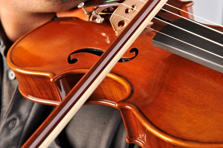 Violin is in the hands of professional violinist.の写真素材