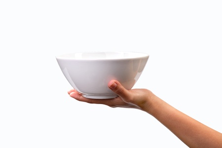 human hand with blank plate isolated on white backgroundの写真素材