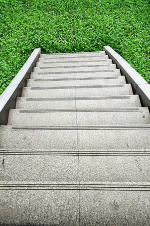 stairway leading up a green hillの写真素材