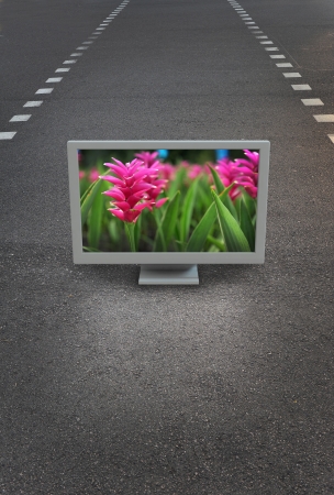 Flat TV placed on urban streetの写真素材
